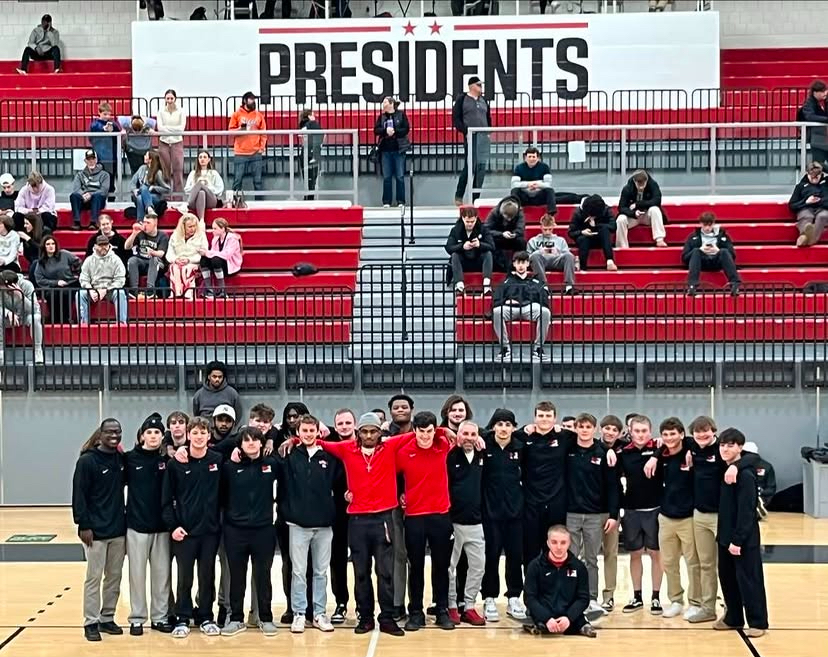 W&J men’s wrestling team posing together in Salvitti Family Gymnasium
